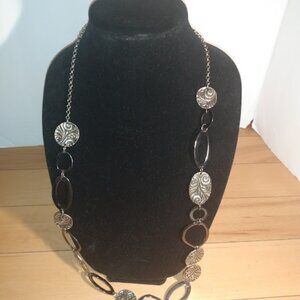 Long metal design links necklace.